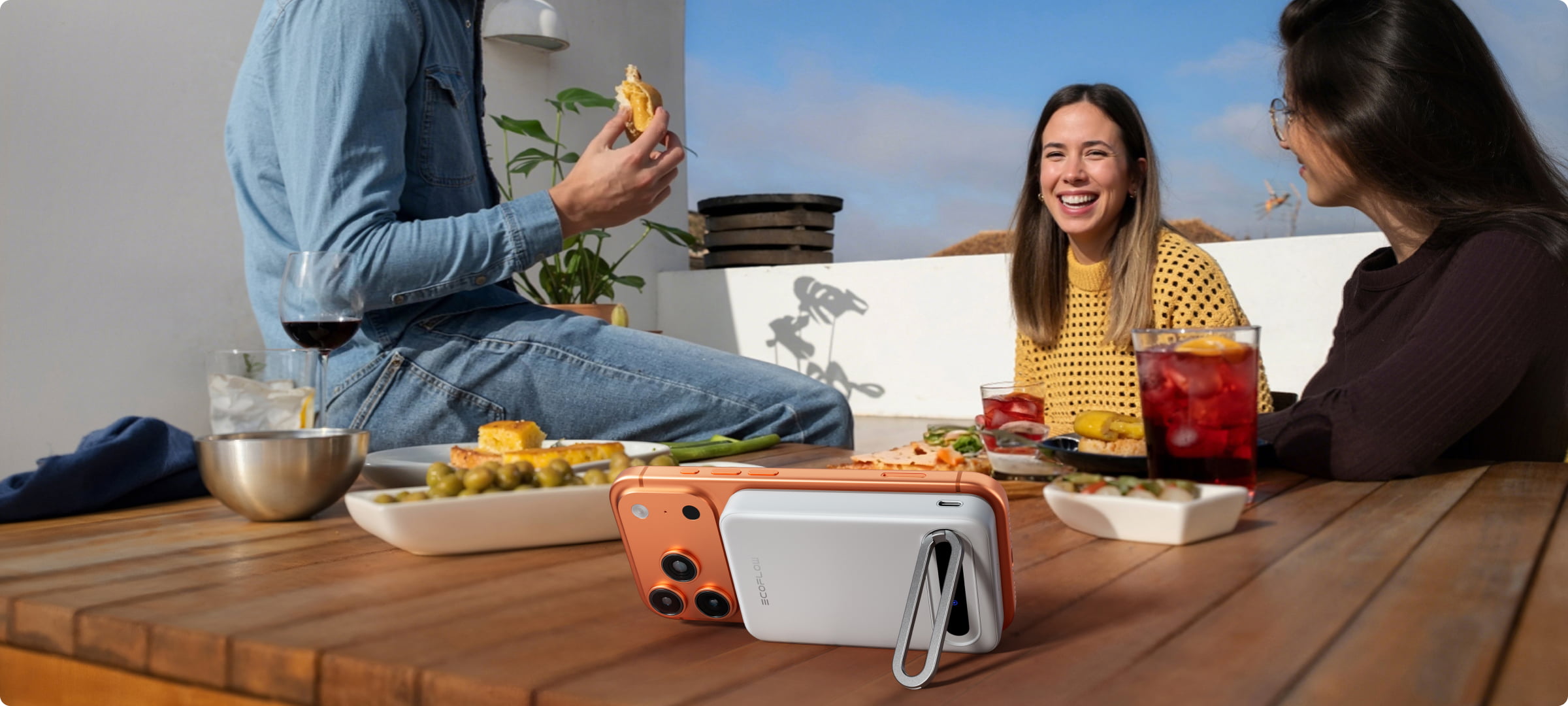 Compact magnetic power bank with built-in USB-C cable attached to smartphone